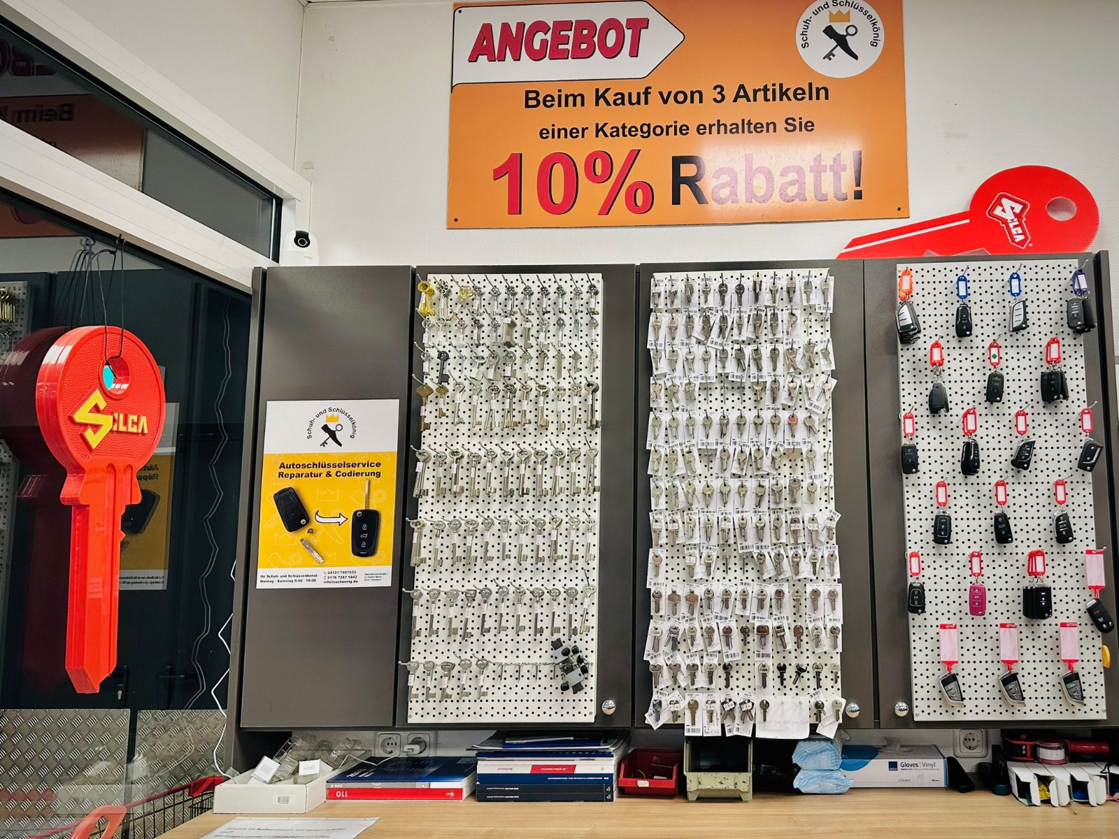 Wall with key blanks and remote controls in the store