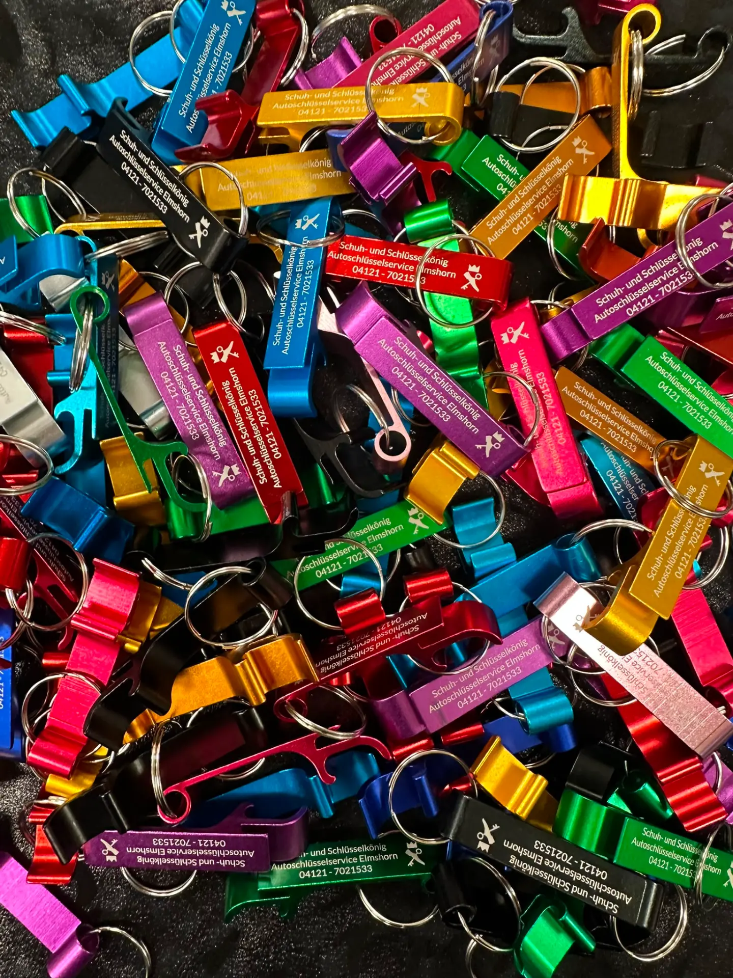 Many colourful engraved aluminium key fobs